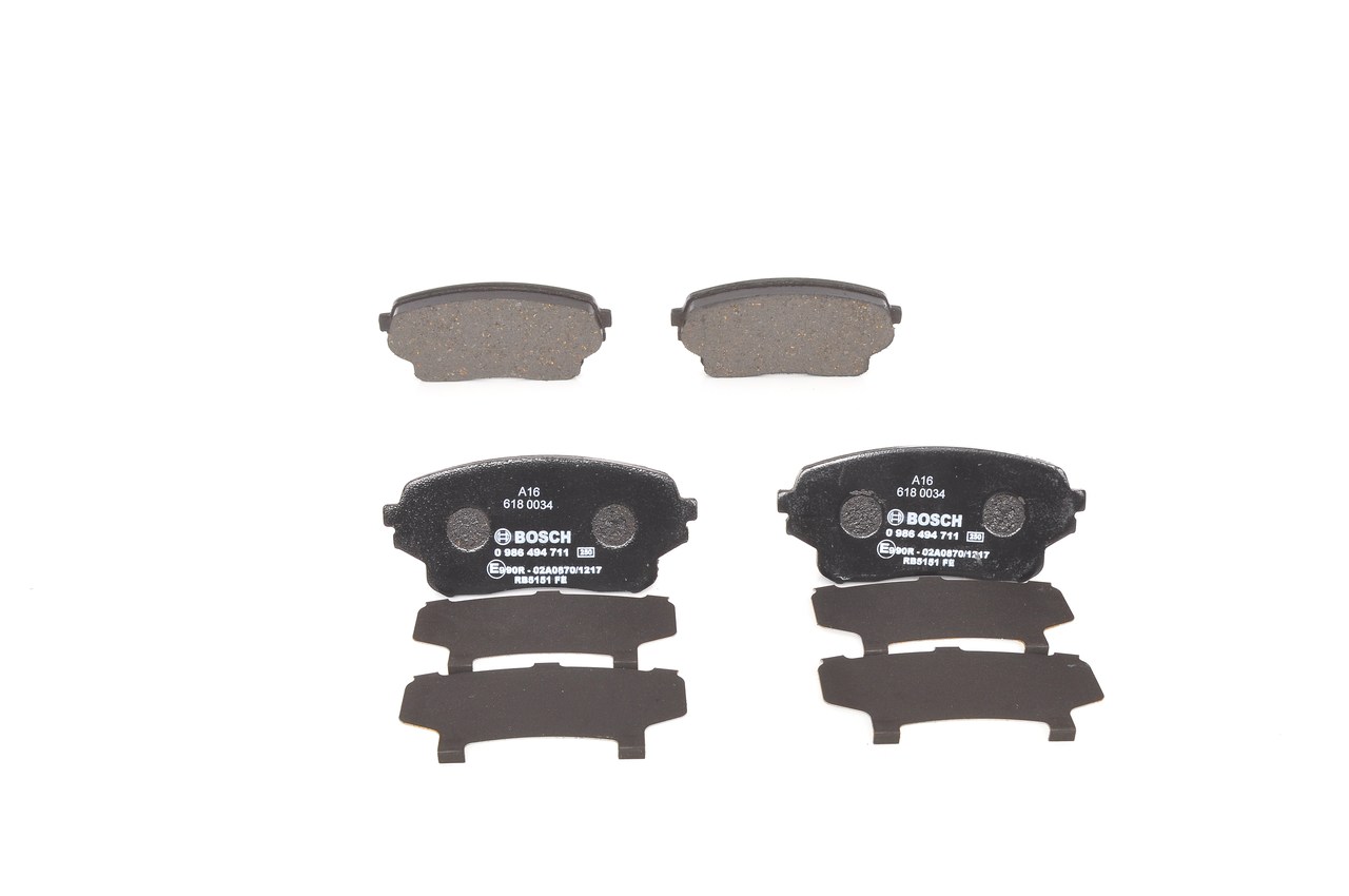 BOSCH 0 986 494 711 Brake pad set Front Axle, Rear Axle, Low-Metallic, with acoustic wear warning, with anti-squeak plate